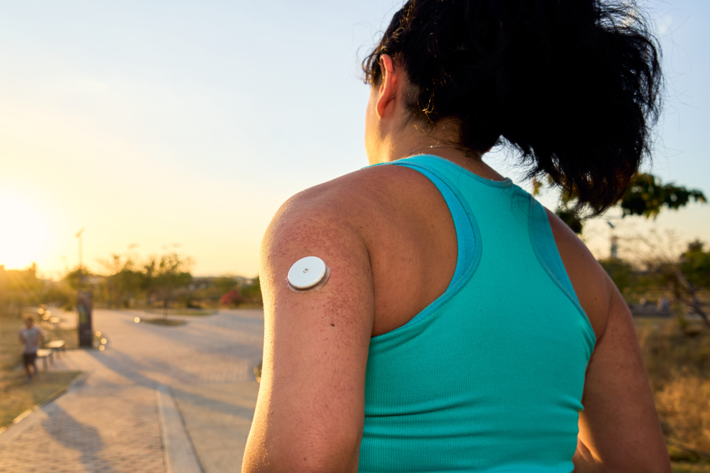 woman running with diabetes patch